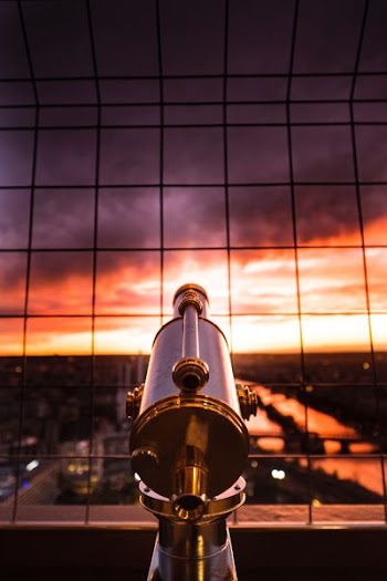 gray and yellow telescope against grill