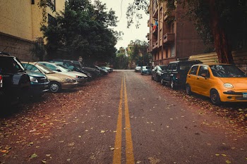 Gray Asphalt Road Between Cars