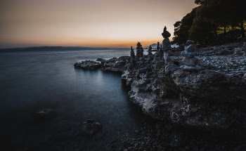 Gray Balance Stone Near the Body of Water