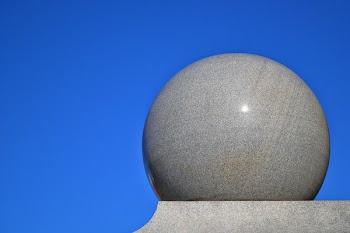 Gray Ball on Gray Surface With Blue Background