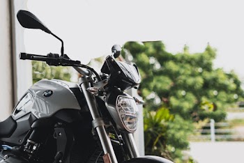 Gray Bmw Motorcycle Near Green Trees