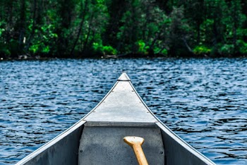 Gray Boat on Body of Water