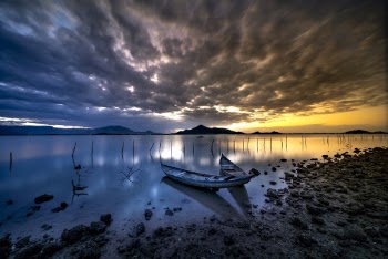 Gray Boat on Shore during Golden Hour