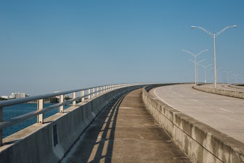 Gray Bridge Near Body of Water