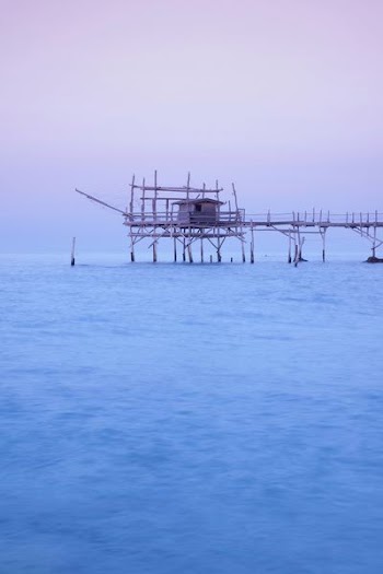 gray bridge on body of water