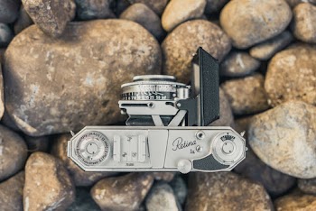Gray Camera on Stones