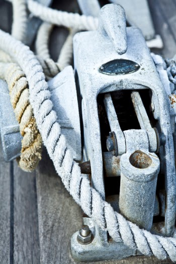 Gray Chain Hoist on Brown Wooden Surface