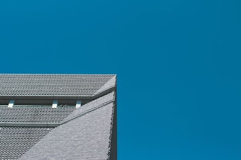 gray concrete building in low angle photography at daytime