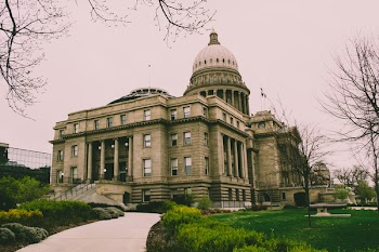 Gray Concrete Building Near Green Grass