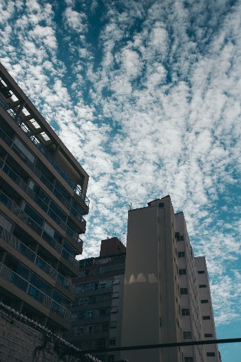 Gray Concrete Building Under A Cloudy Sky