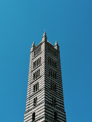 Gray Concrete Building Under Blue Sky