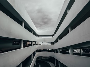 gray concrete building under cloudy sky
