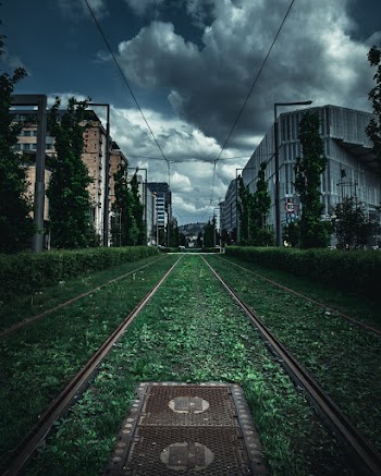 Gray Concrete Building Under Cloudy Sky