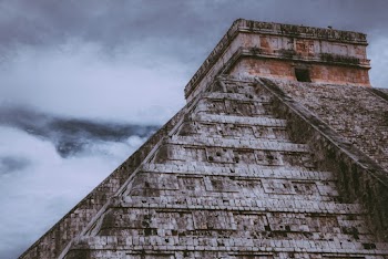 Gray Concrete Building Under White Clouds