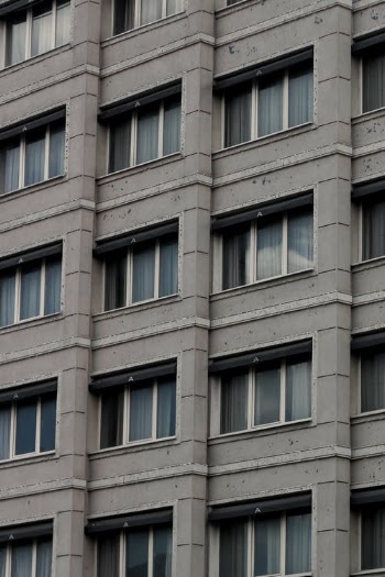 Gray Concrete Building with Glass Windows · Free Stock Photo