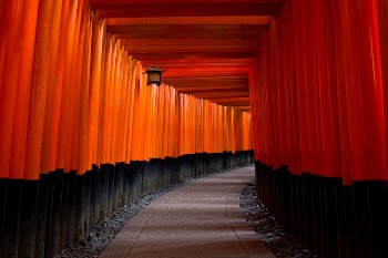 Gray Concrete Pathway Between Red-and-black Pillars