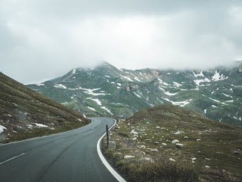 Gray Concrete Pavement Under White Cloudy Sky