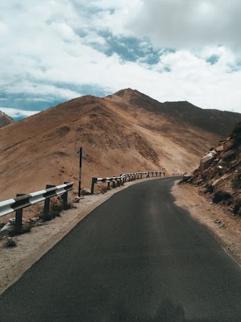 Gray Concrete Road Beside Mountain