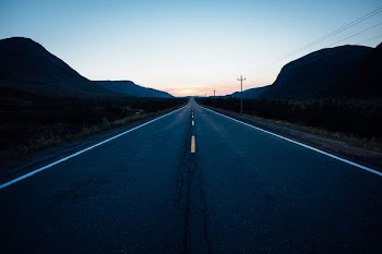 gray concrete road during nighttime