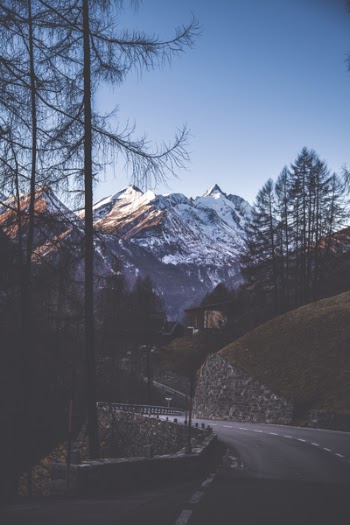 Gray Concrete Road With Trees and Mountain
