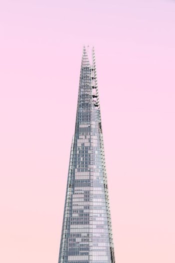 gray concrete tower under cloudy sky