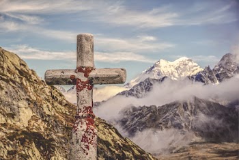 Gray Cross on Mountains 