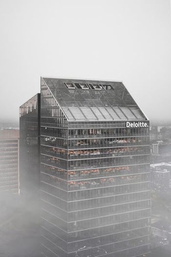 gray Deloitte building during daytime