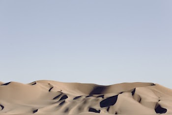 Gray Desert Under Blue Sky