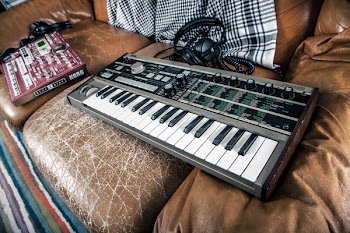 Gray Electronic Keyboard on Sofa