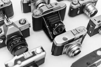 Gray Folding Camera on White Surface