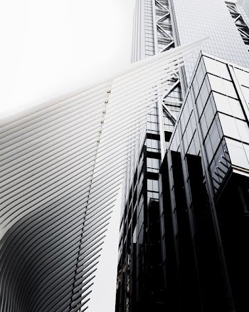 gray high-rise building in worm's eye view