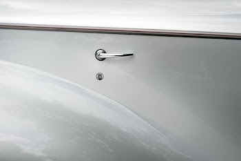 gray knob on gray wall