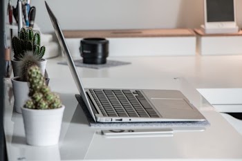 gray laptop computer open on table
