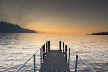 gray metal dock facing horizon