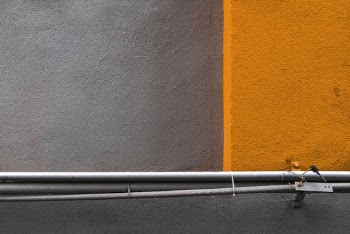 Gray Metal Pipe Beside Wall
