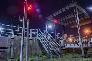 Gray Metal Stairs Near Road and Traffic Light