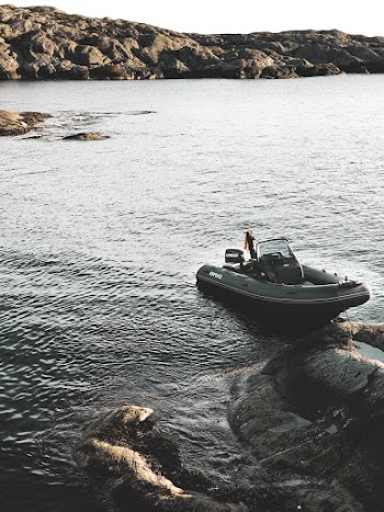 Gray Motorboat at Water