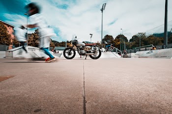 Gray Motorcycle Parked on Skateboard Park