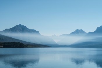 gray mountain covering with fogs