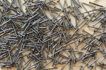 Gray Nails on Brown Surface