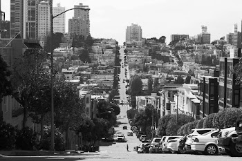 gray pave road on high-city buildings