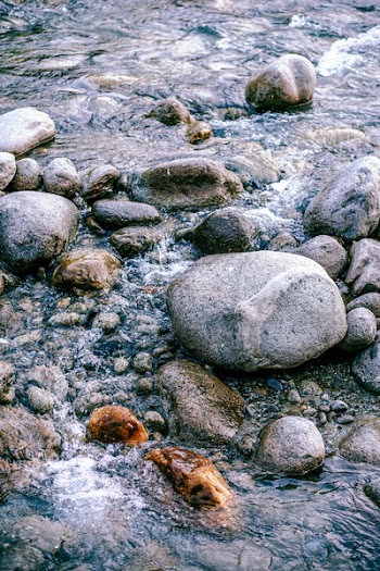 Gray Pebbles in Body of Water