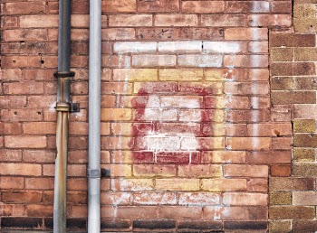 Gray Pipe on Brick Wall
