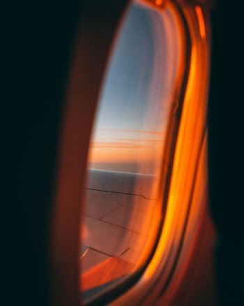 gray plane at the sky
