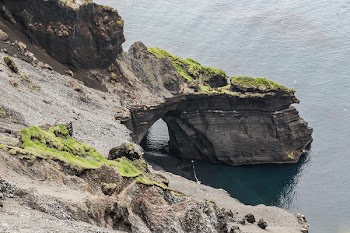 Gray Promontory Near Body of Water