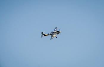 Gray Propeller Plane Under Blue Sky