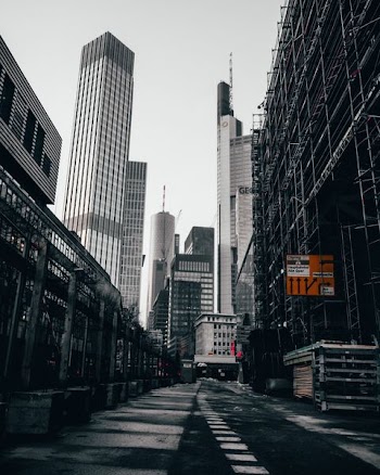 gray road between skyscrapers