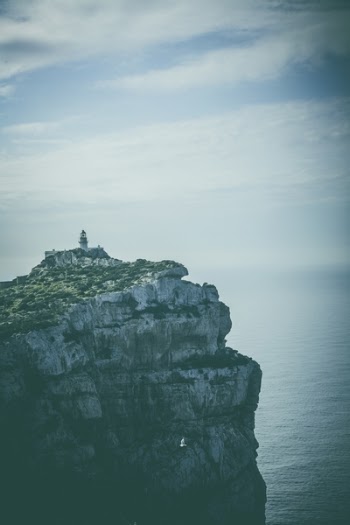Gray Rock Cliff Beside Body of Water