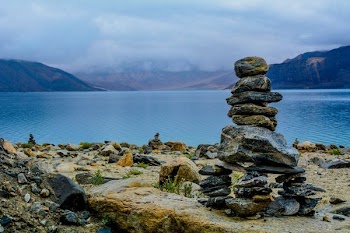 gray rocks stacks on brown surface