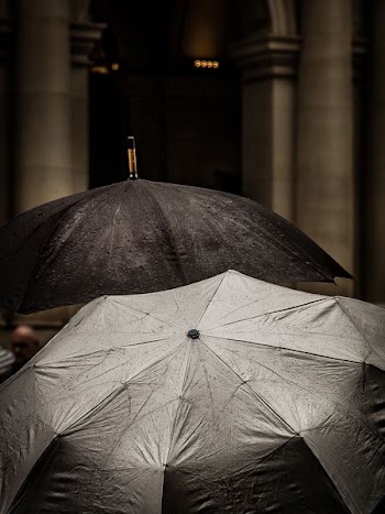 gray scale of two gray umbrellas